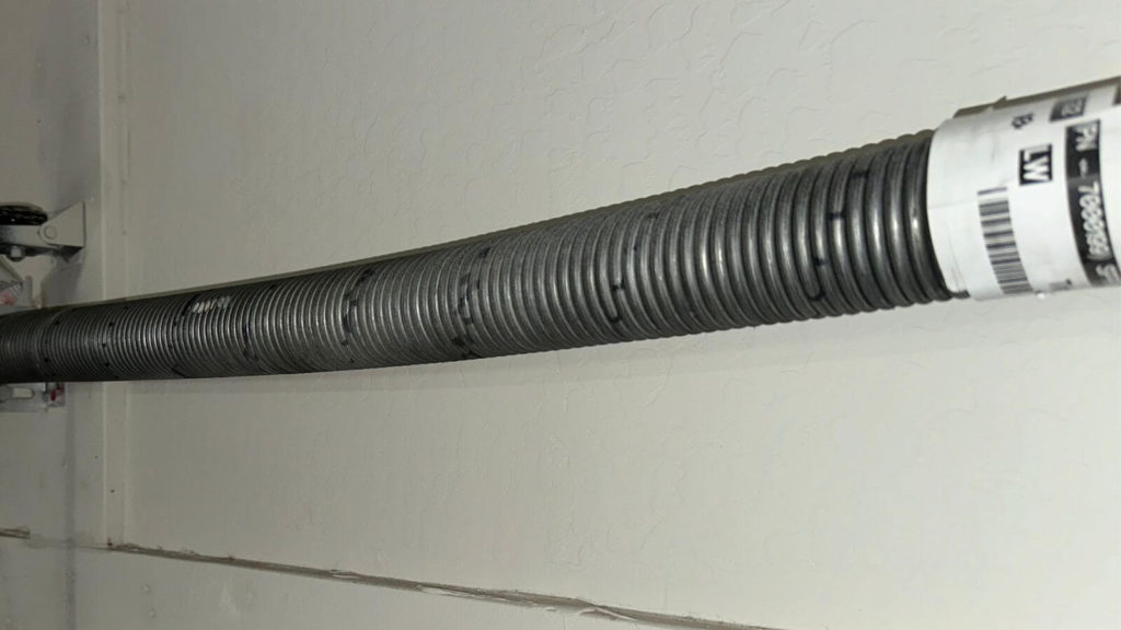 Extension style garage door spring