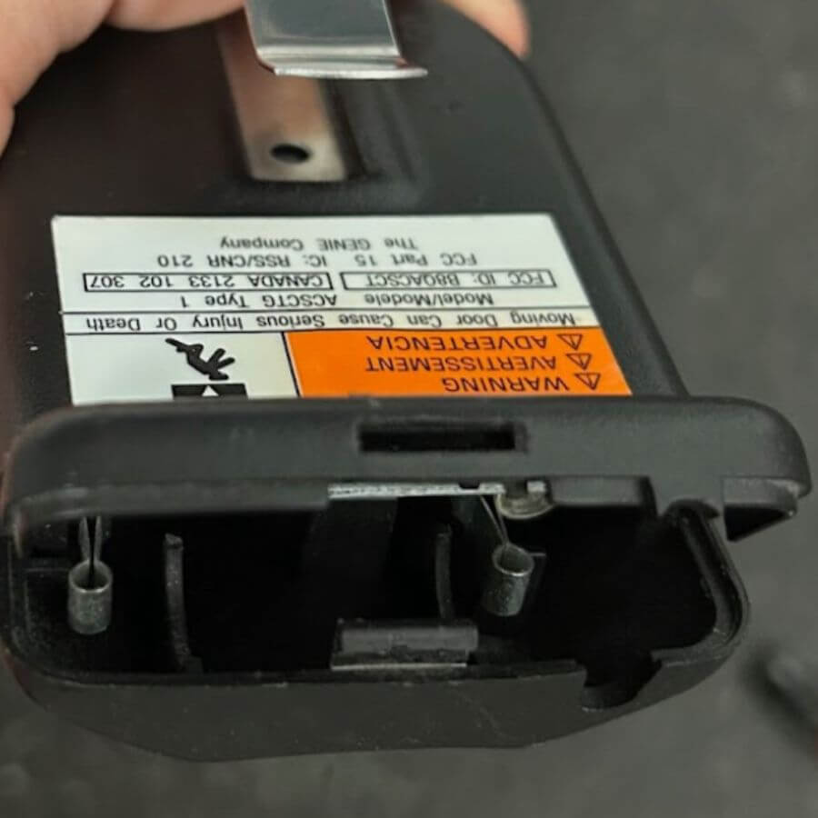 loose components in the battery area of garage door remote